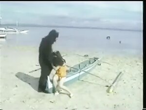 Extreme zoophilia scene with a gorilla and a sleeping Asian