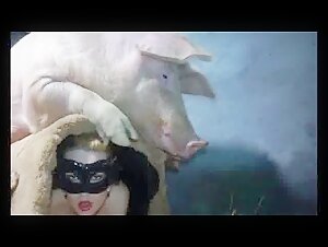 Bestiality: a woman and a pig in a hard scene