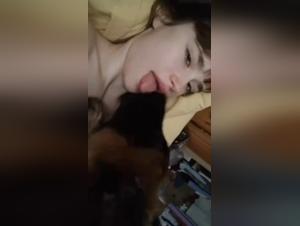 Naked woman gets licked by her dog